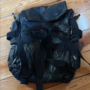 NWOT Carroll Black Leather  Road Large Pack.  Multi-zip compartments.